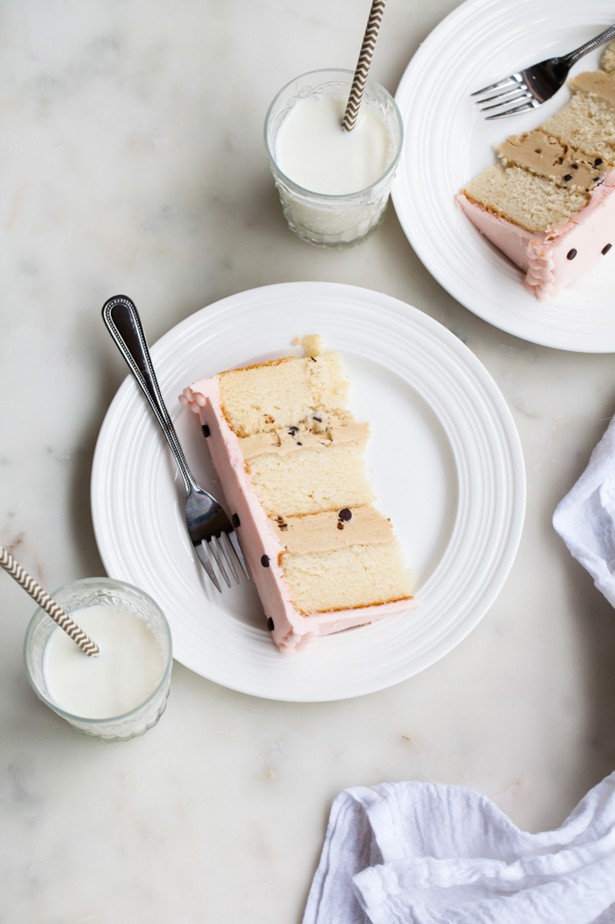 A slice of cake with cookie dough filling