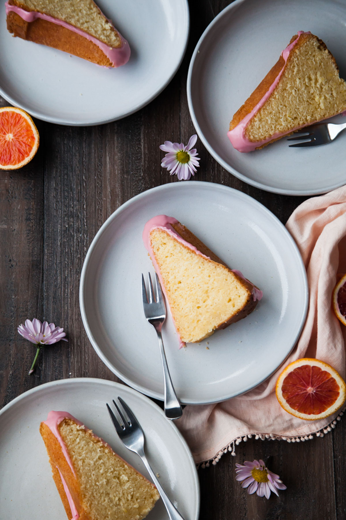A slices of moist orange pound cake on plates 