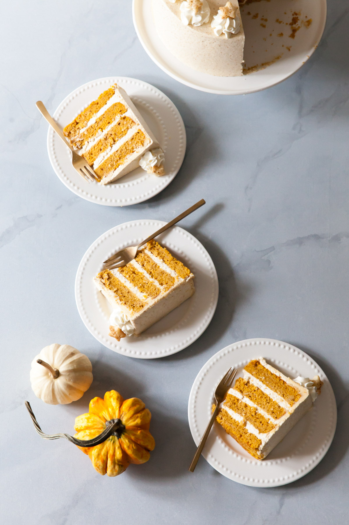 Slices of pumpkin cake with graham cracker buttercream