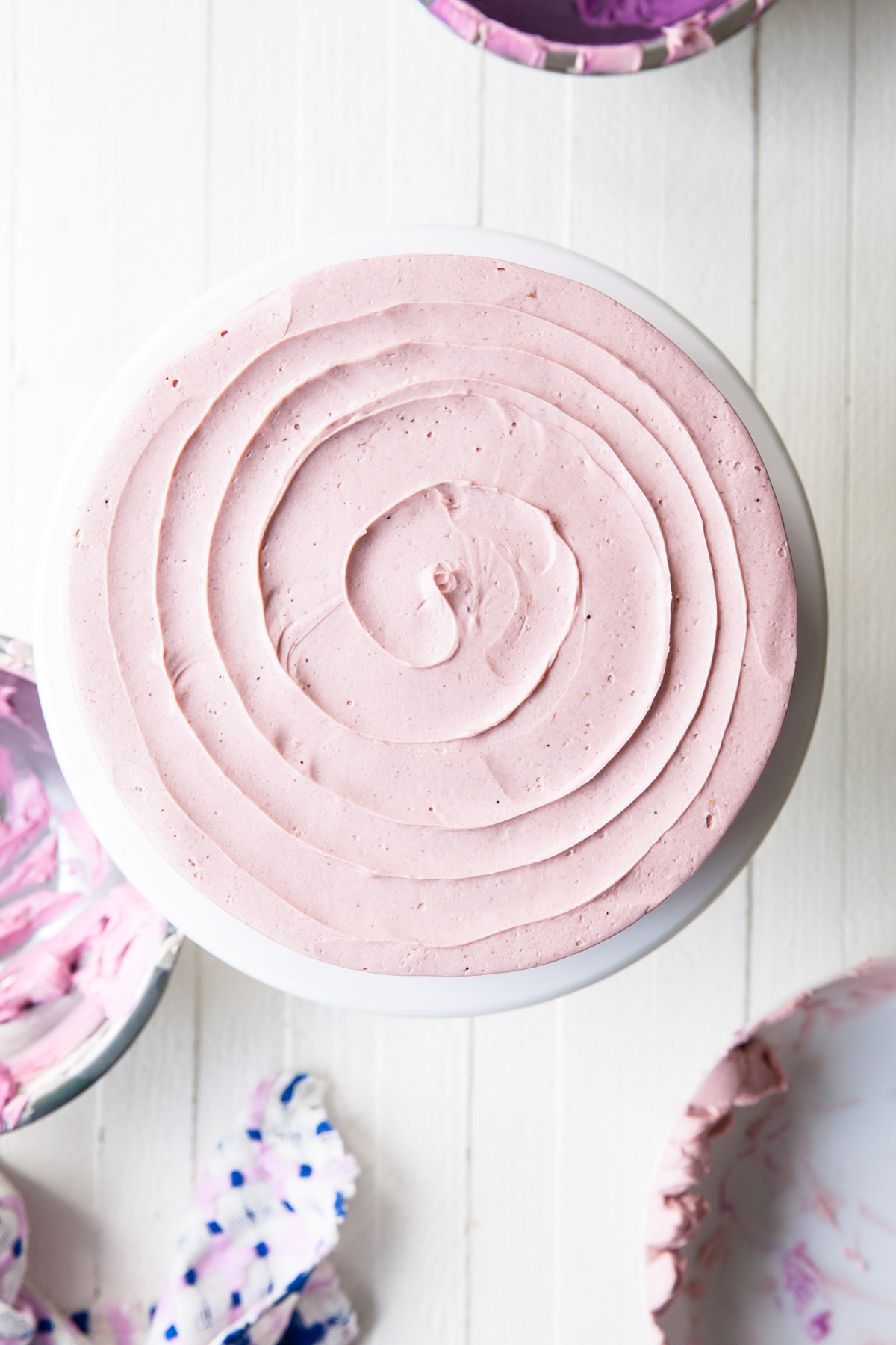 A buttercream swirl on top of a layer cake.