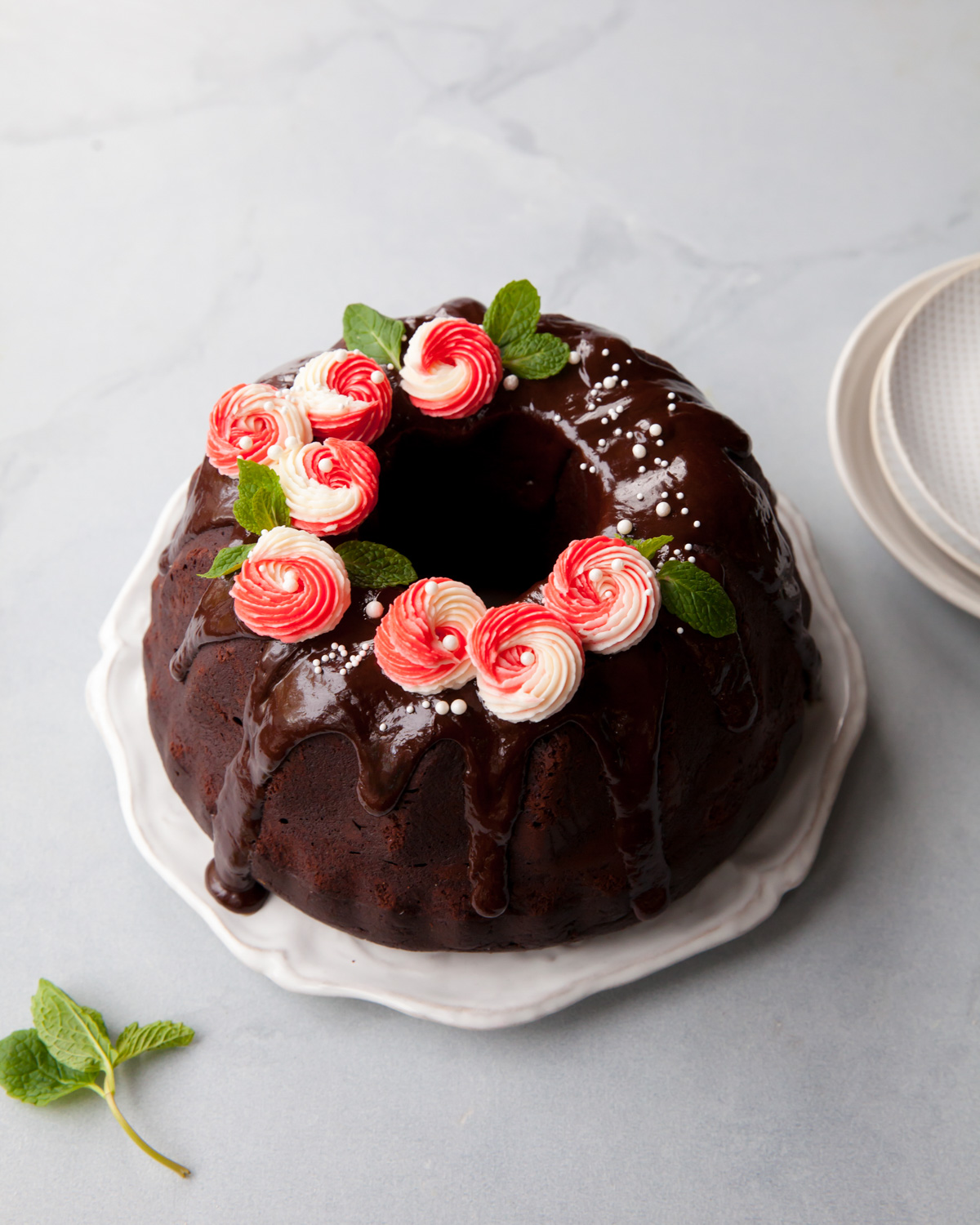 A chocolate bundt cake with chocolate peppermint glaze