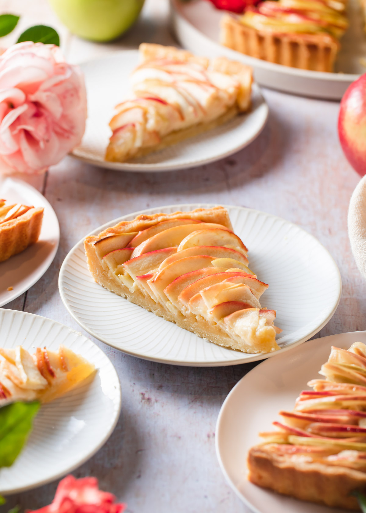 Slices of apple rose tart with almond frangipane filling
