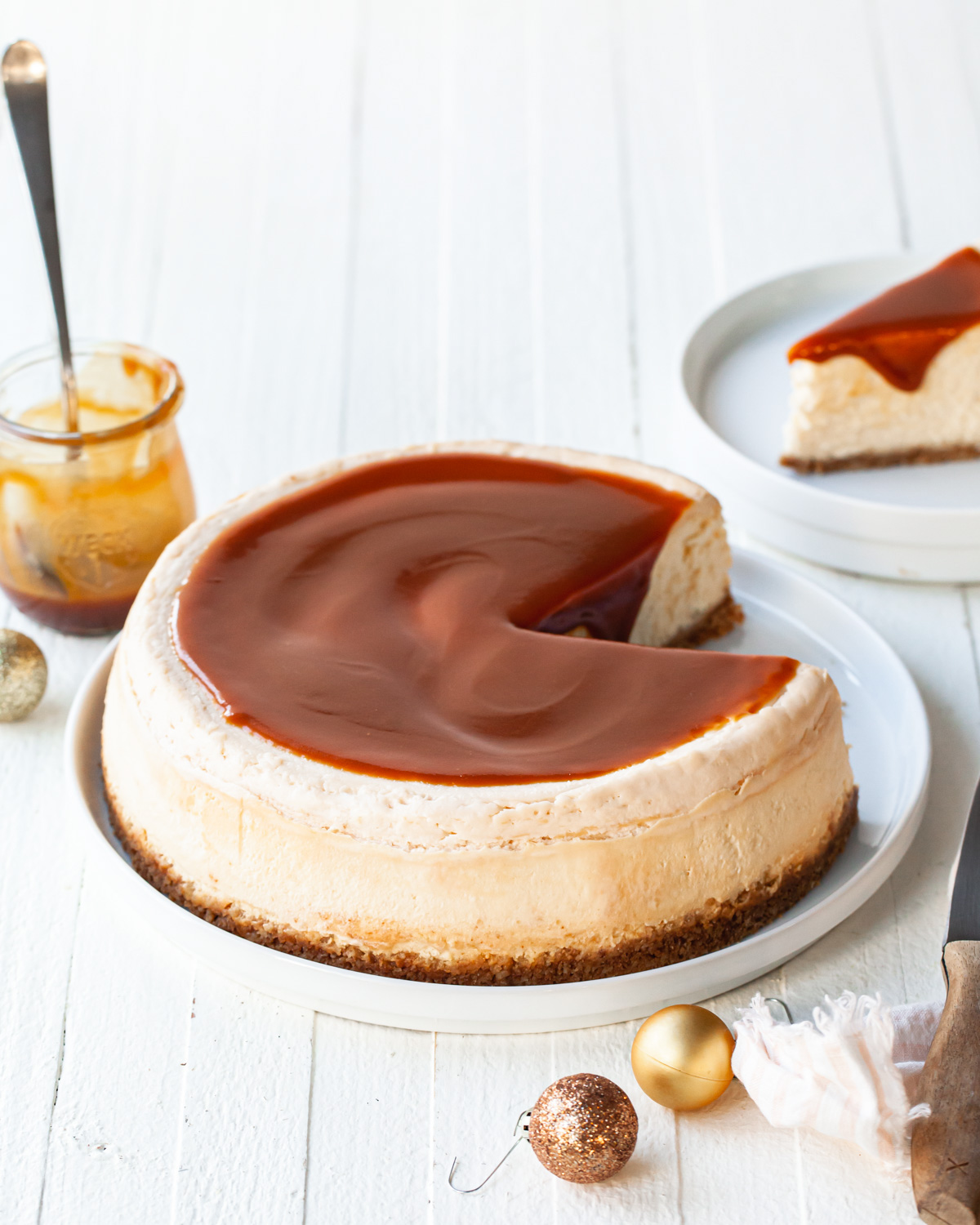 A baked and sliced caramel cheesecake