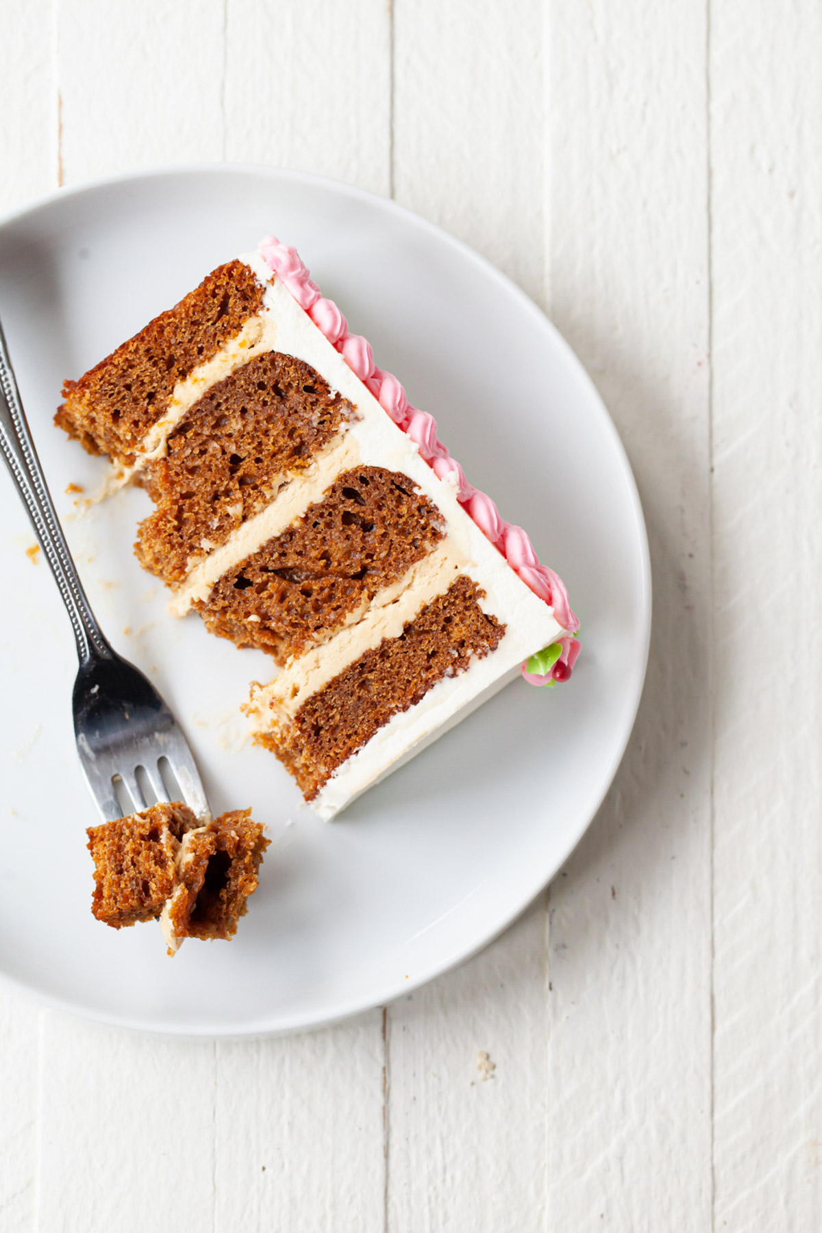a slice of gingerbread layer cake with cookie butter filling