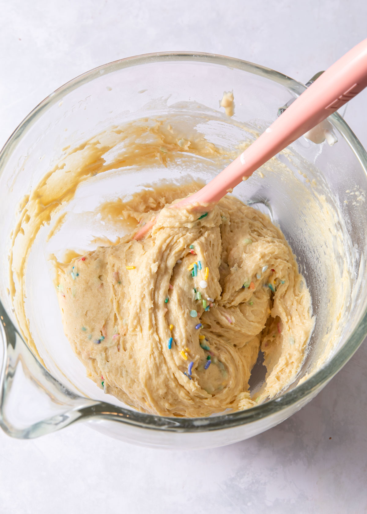 Folding sprinkles into birthday coffee cake batter