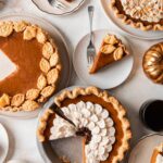 a table full of pumpkin pies