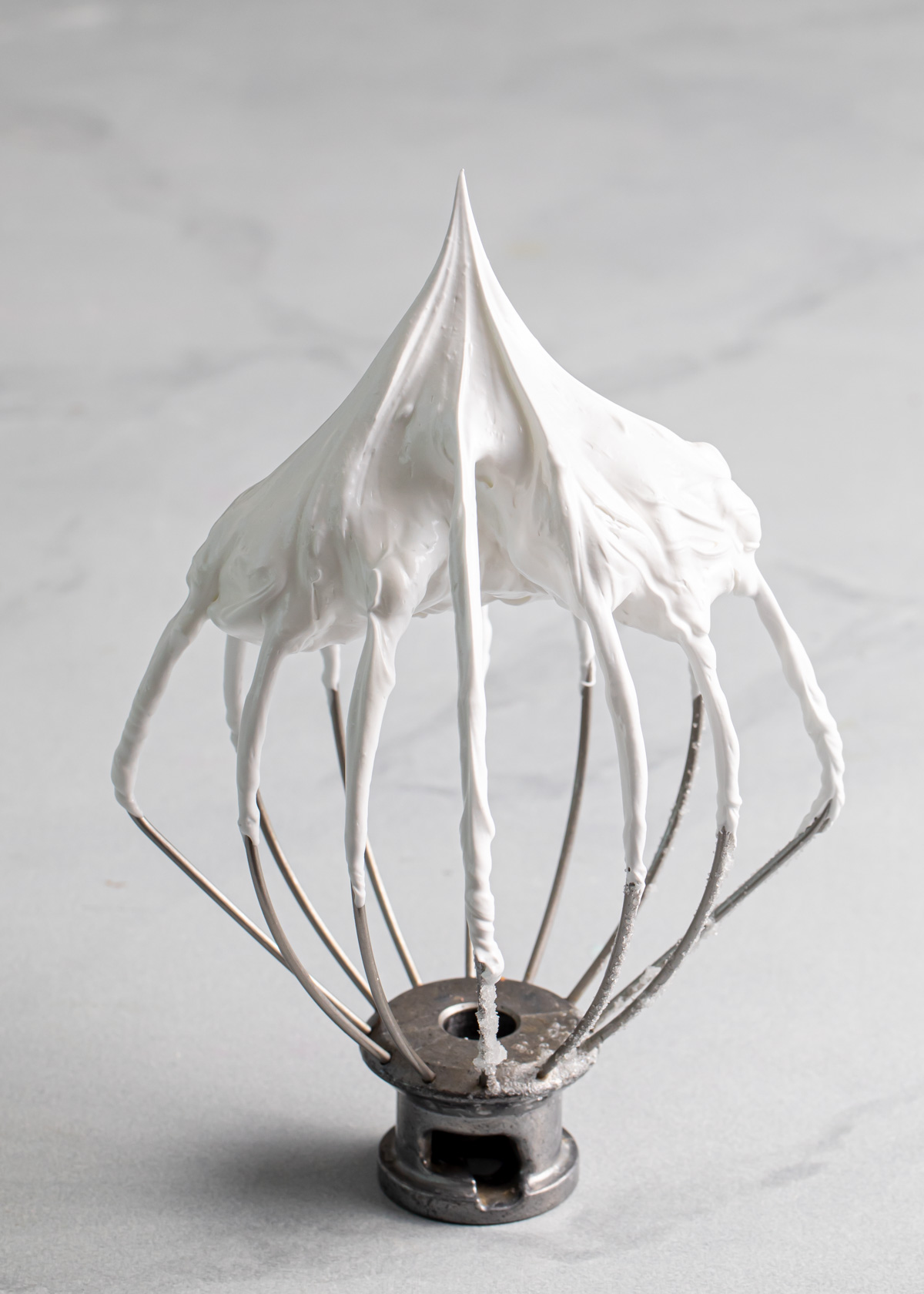 A whisk with stiff peaks French meringue