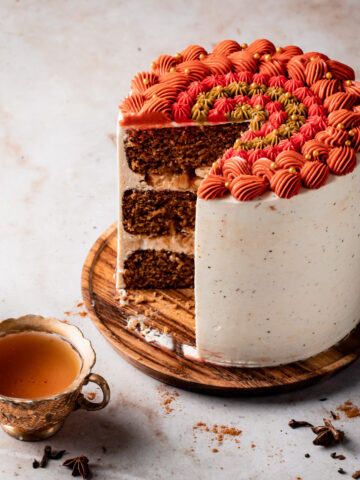 Chai spice cake with three layers of spice cake and chair Swiss meringue buttercream