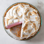 Baked Alaska Ice cream pie with strawberry ice cream and torched meringue on top