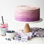 A blueberry layer cake with purple ombre frosting