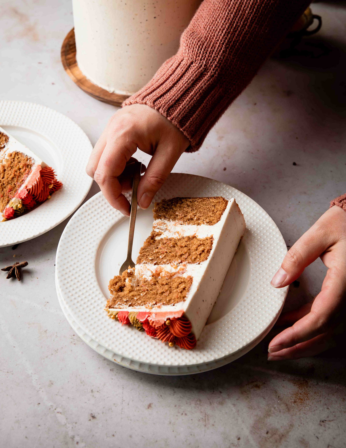 A slice of chai spice cake about to be eaten