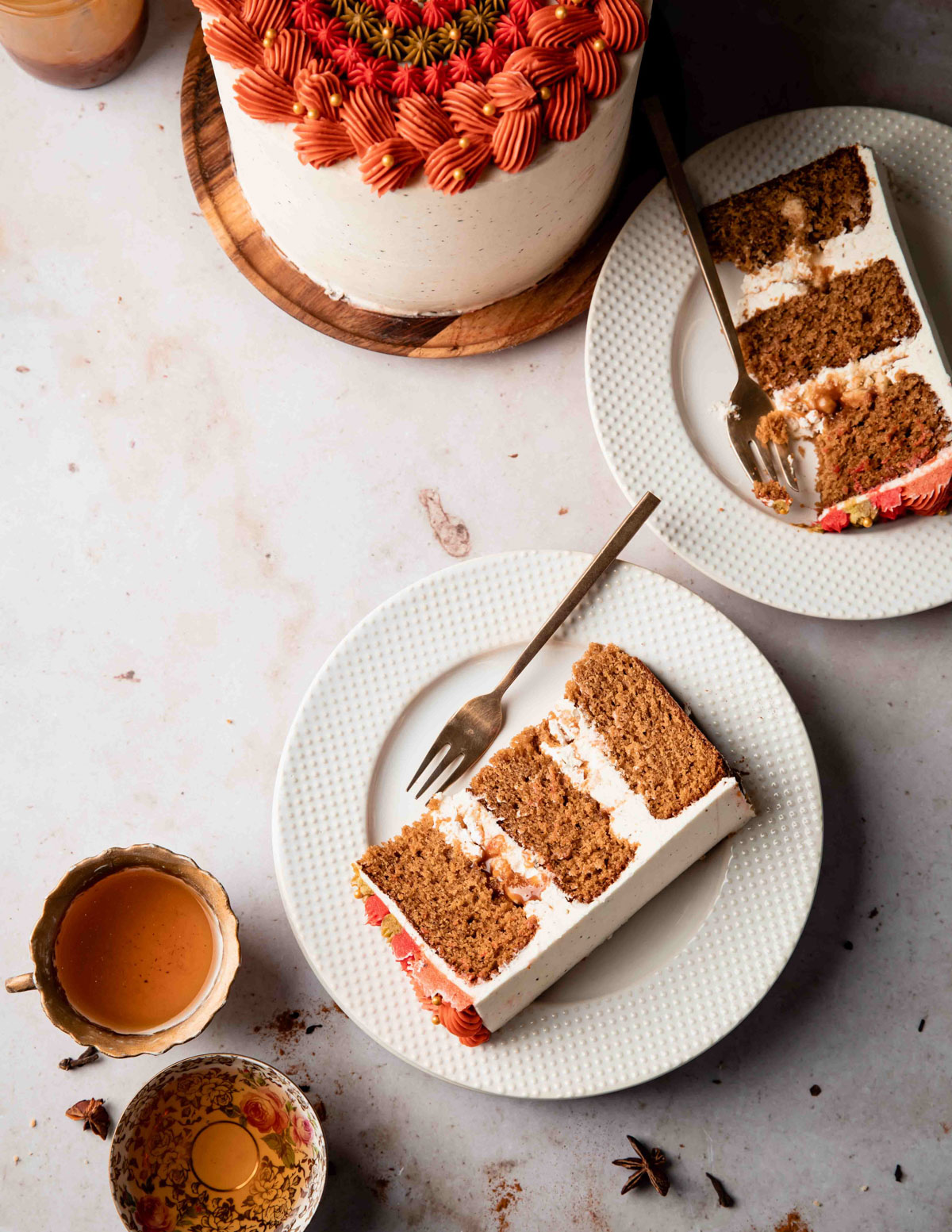 An overhead image of two slices of chai spiced cake