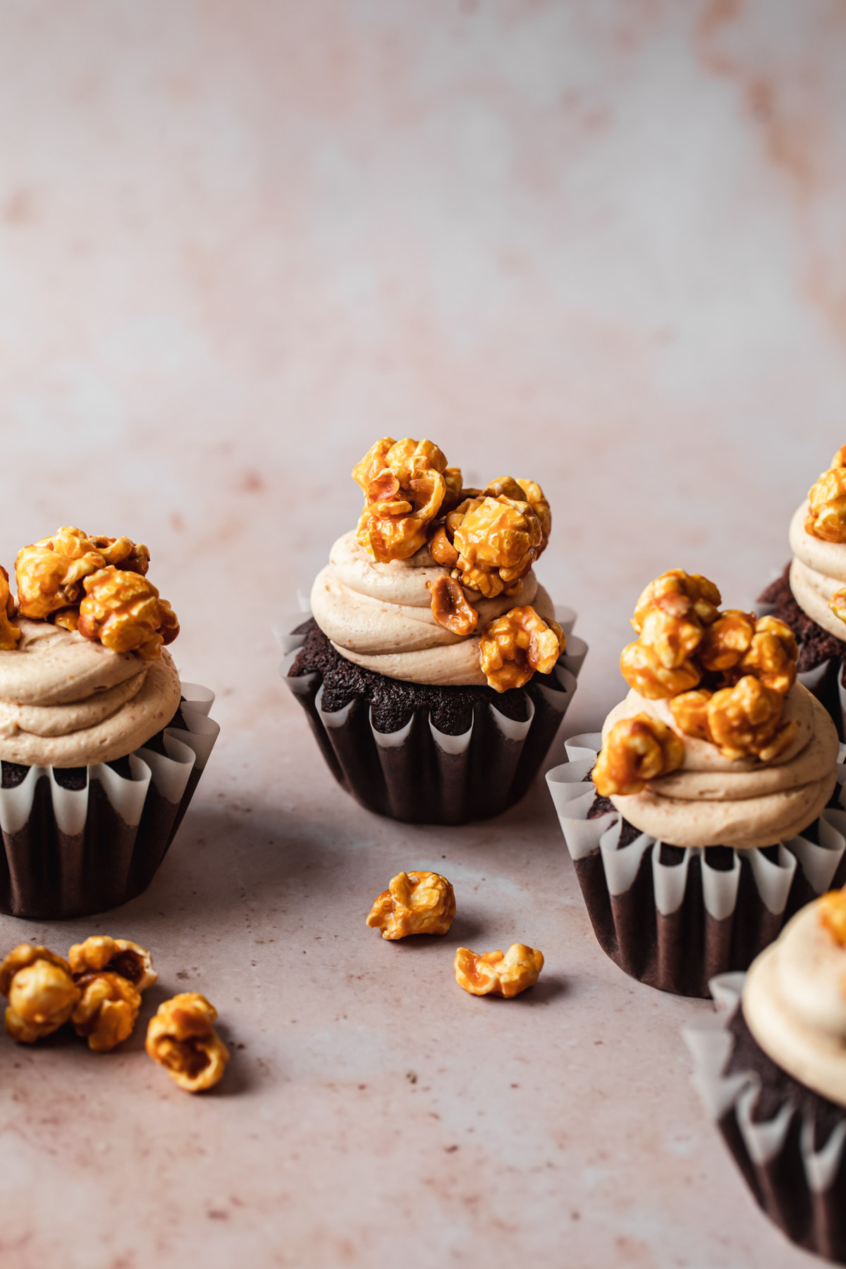 Chocolate peanut butter cupcakes with caramel corn on top