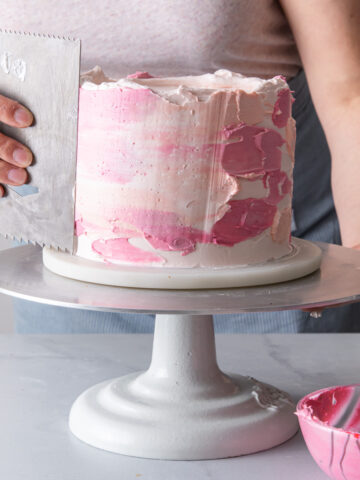 Frosting a watercolor buttercream cake