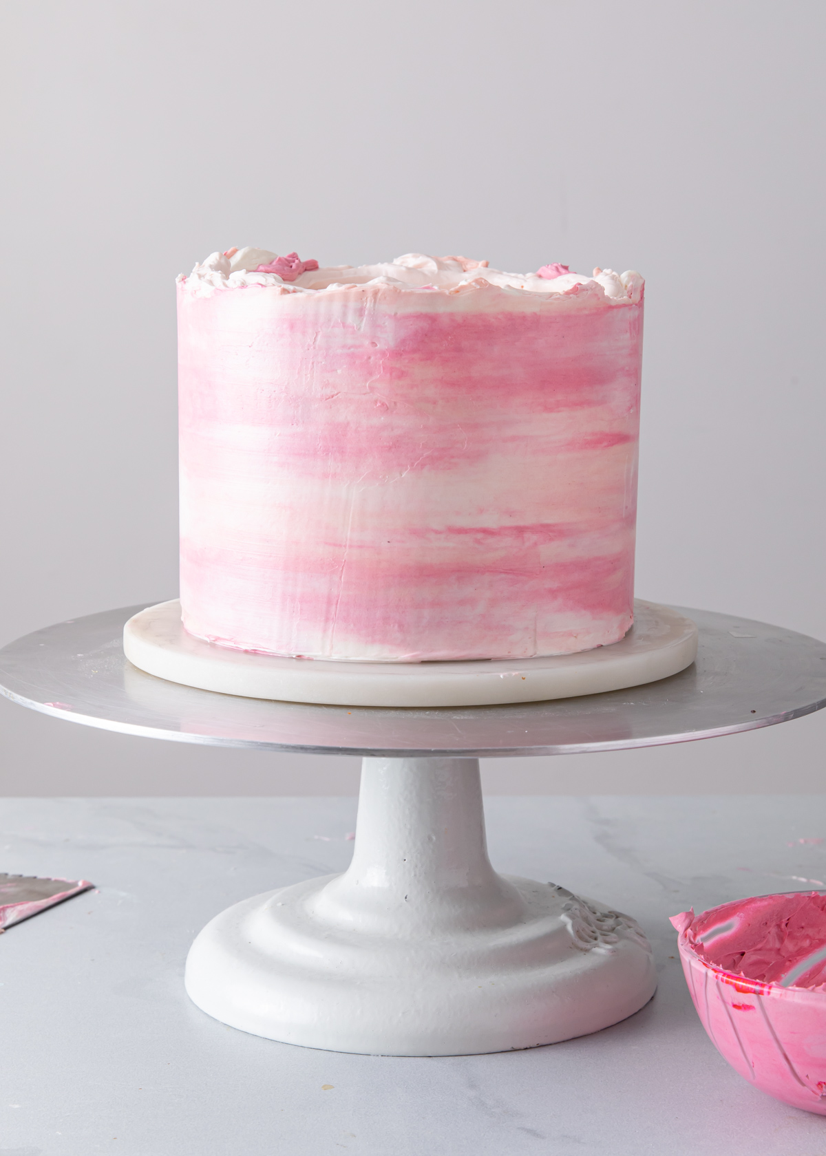 A smooth watercolor buttercream cake