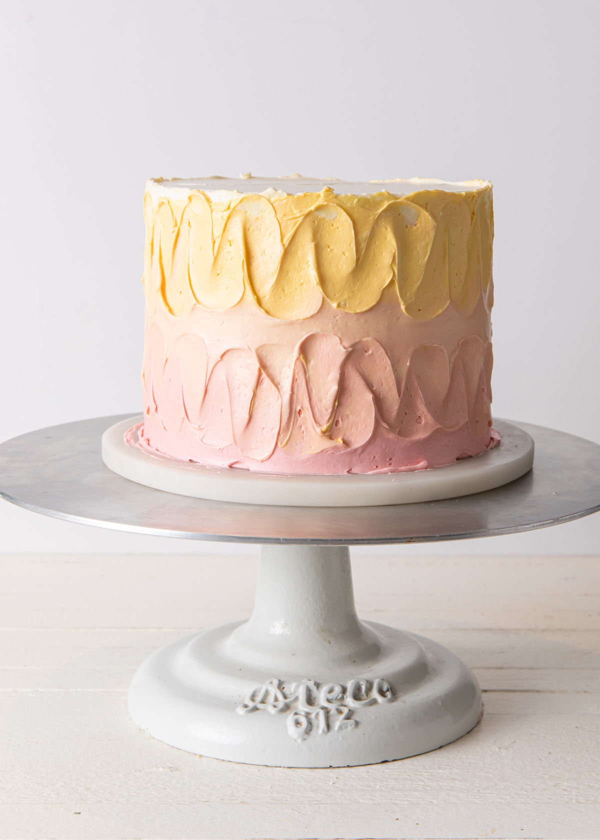 Blending the buttercream on an ombre cake