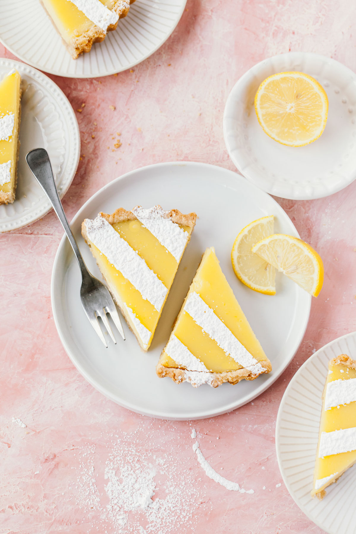 Slices of lemon tart with confectioners' sugar dusted on top
