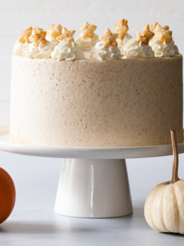 A pumpkin pie layer cake with whipped cream