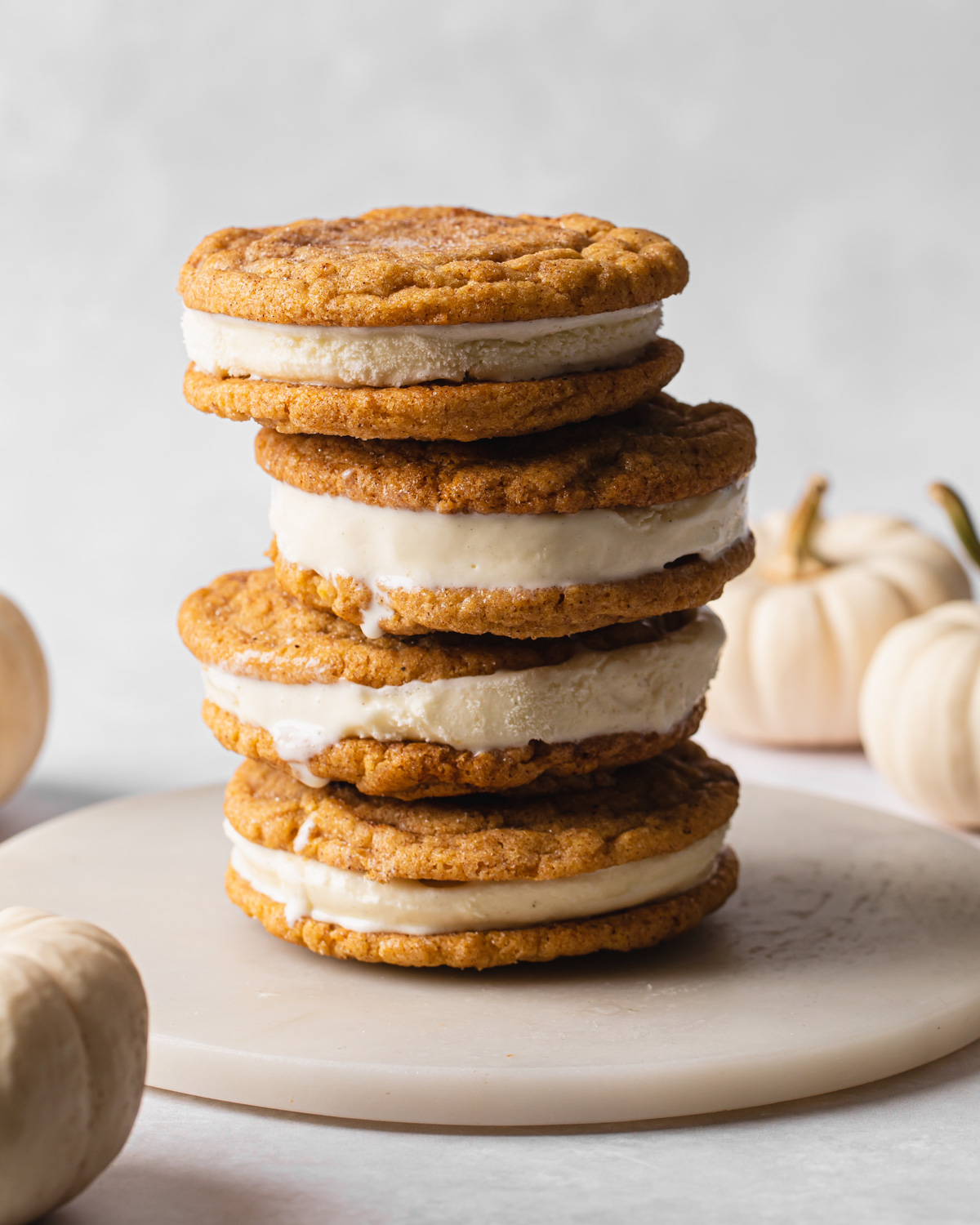 a stack of ice cream sandwiches made with pumpkin snicerdoodles