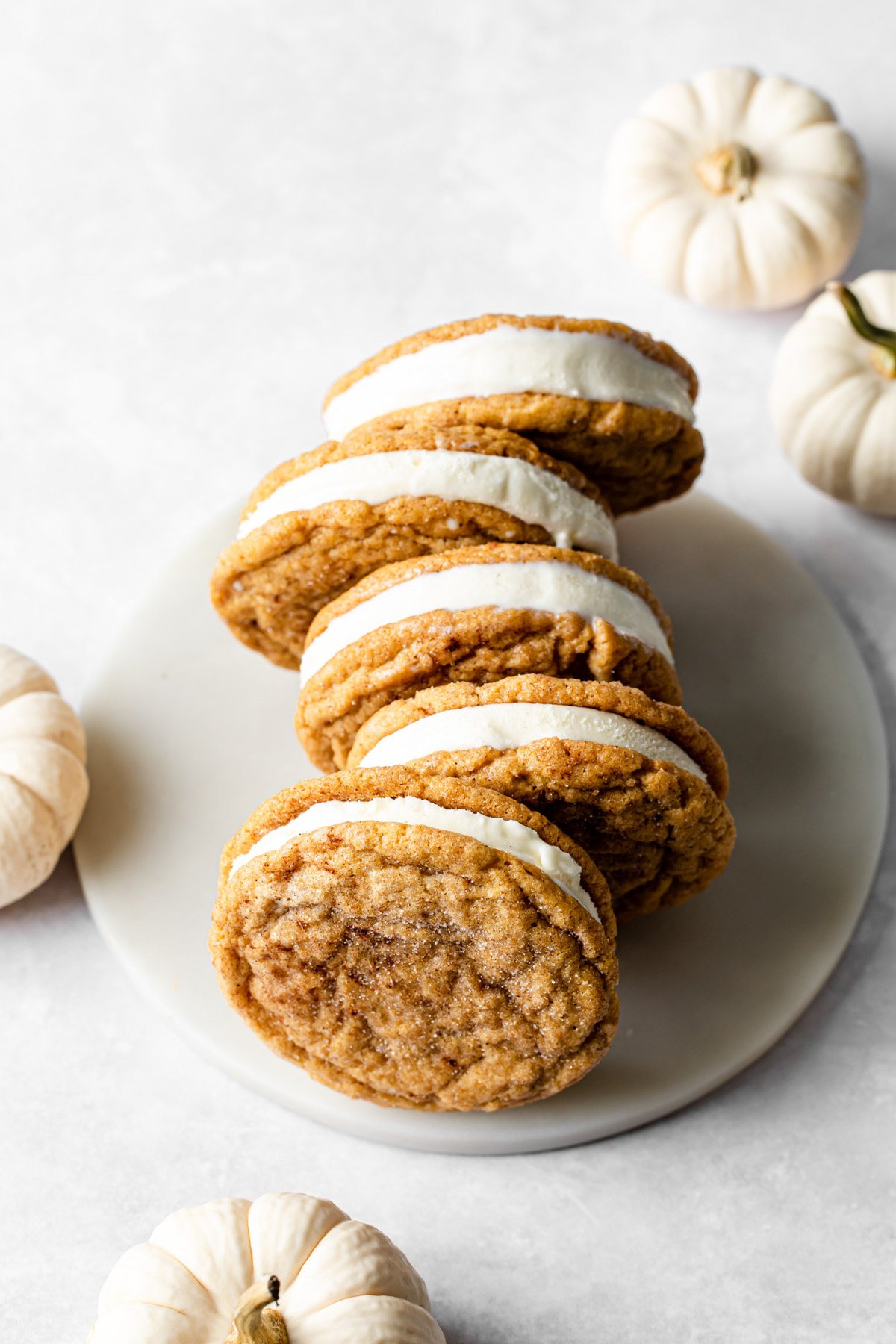 pumpkin snickerdoodle ice cream sandwiches lined up in a row