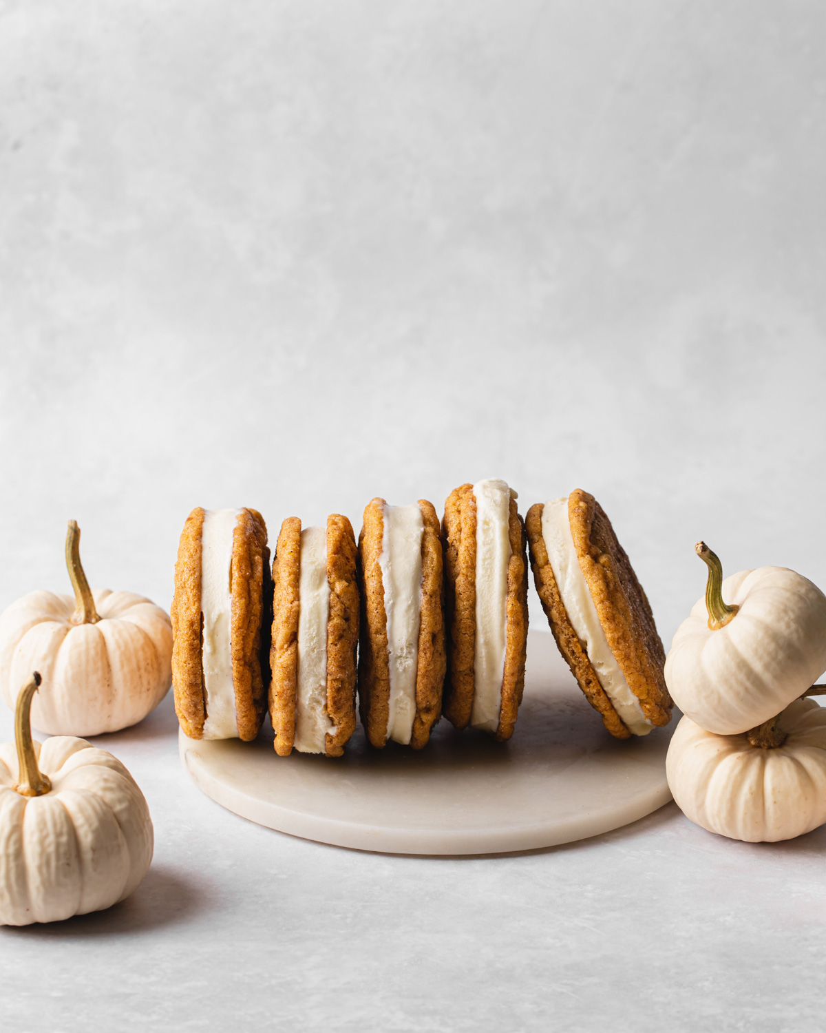 pumpkin snickerdoodles sandwiched with vanilla ice cream