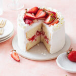 A mini chiffon cake with strawberry filling and whipped cream frositng