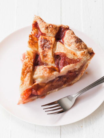 A slice of strawberry peach pie