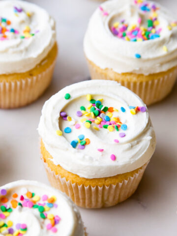 Vanilla cupcakes with homemade vanilla frosting and sprinkles