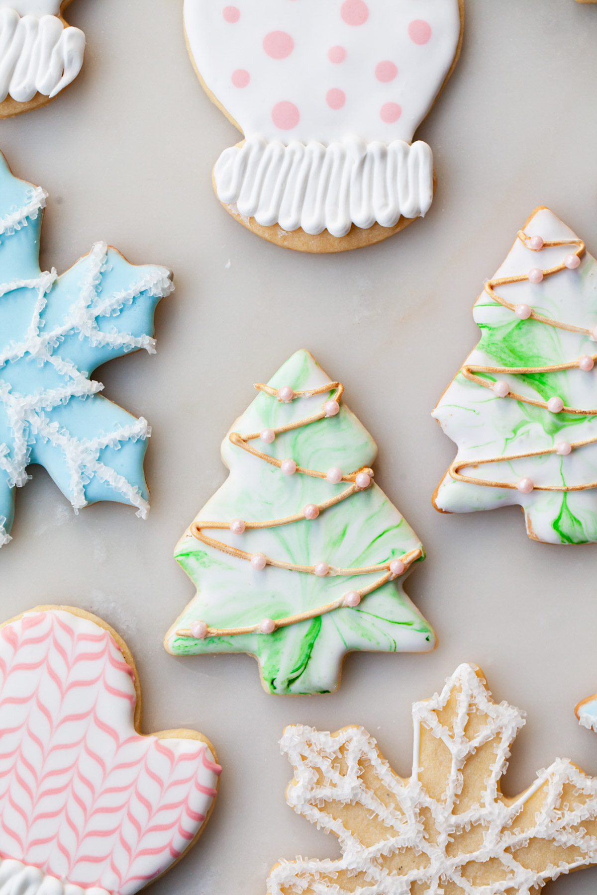 decorating Christmas sugar cookies with royal icing