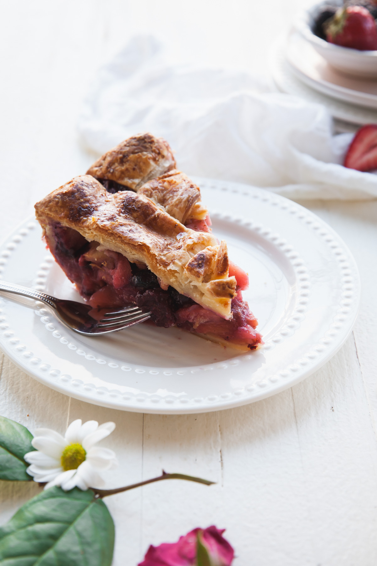 A slice of mixed berry apple pie