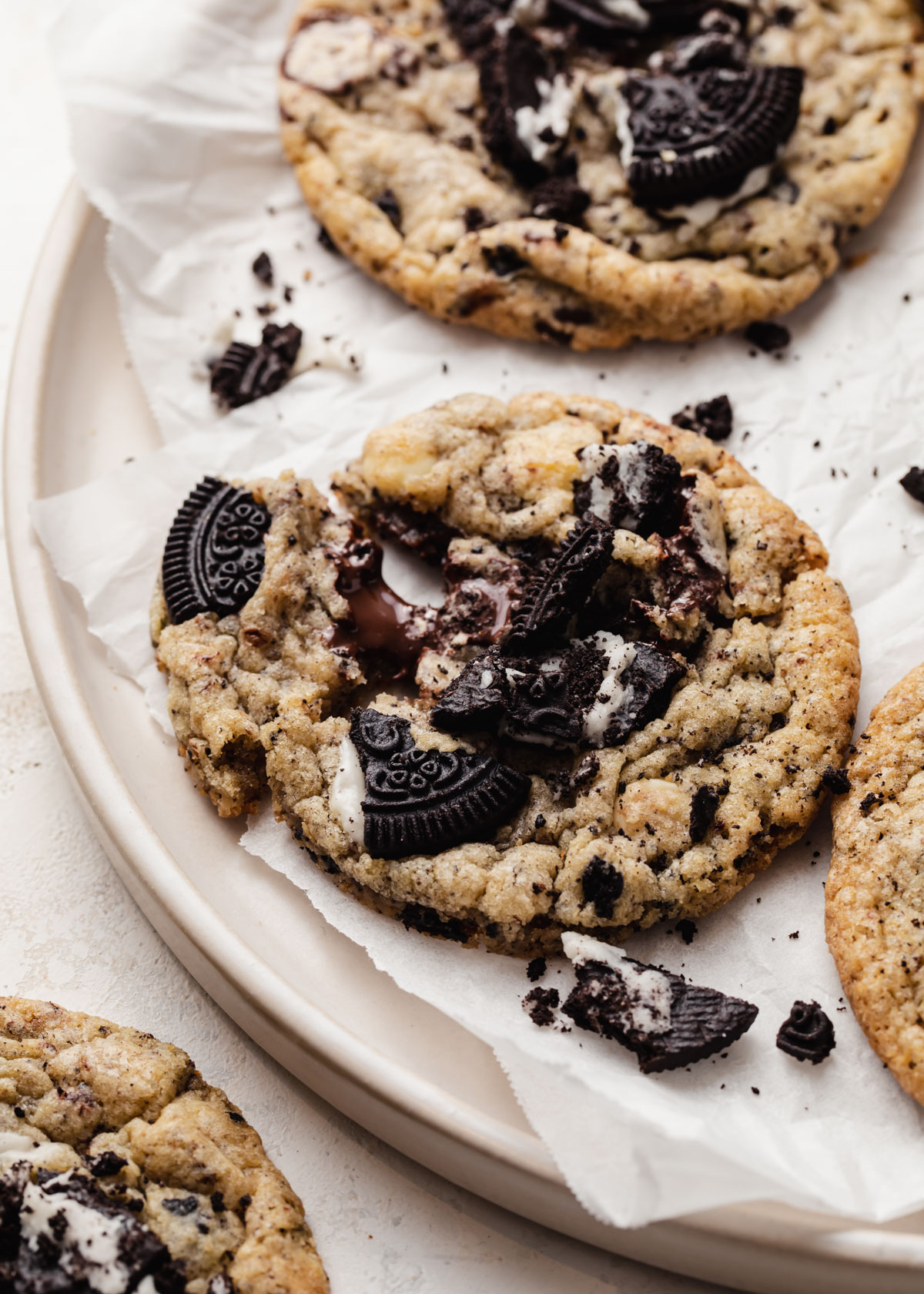 A freshly baked Oreo chocolate chip cookie on a plate