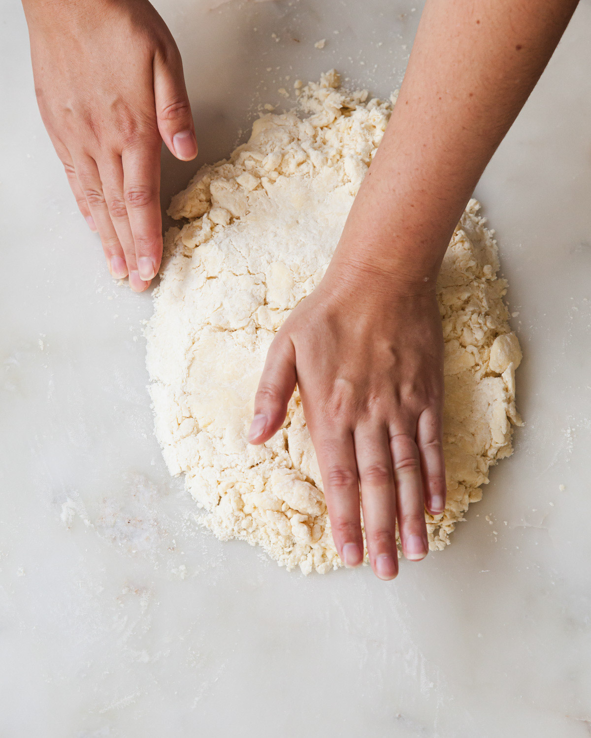 Flattening out pie dough by hand