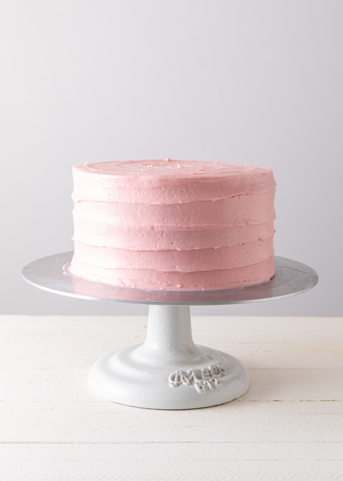 A striped buttercream cake