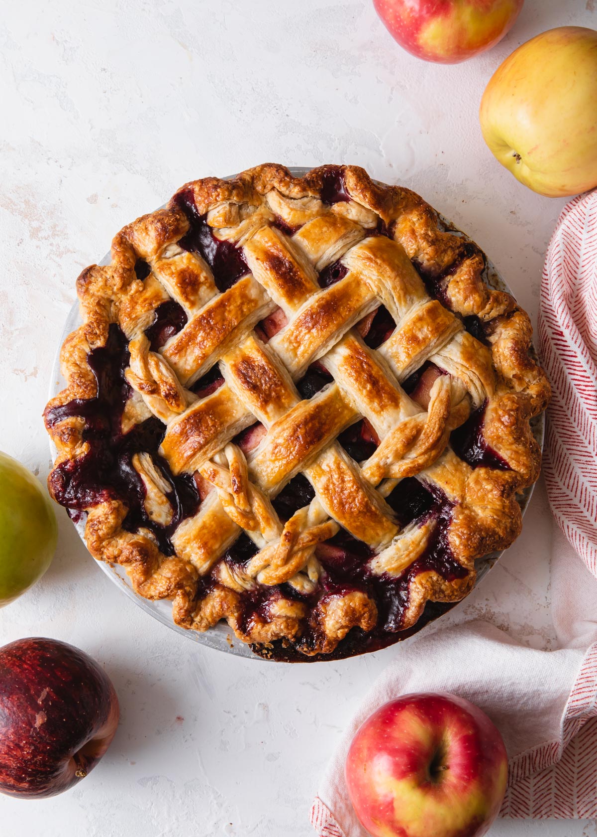 A baked apple blueberry pie with lattice crust