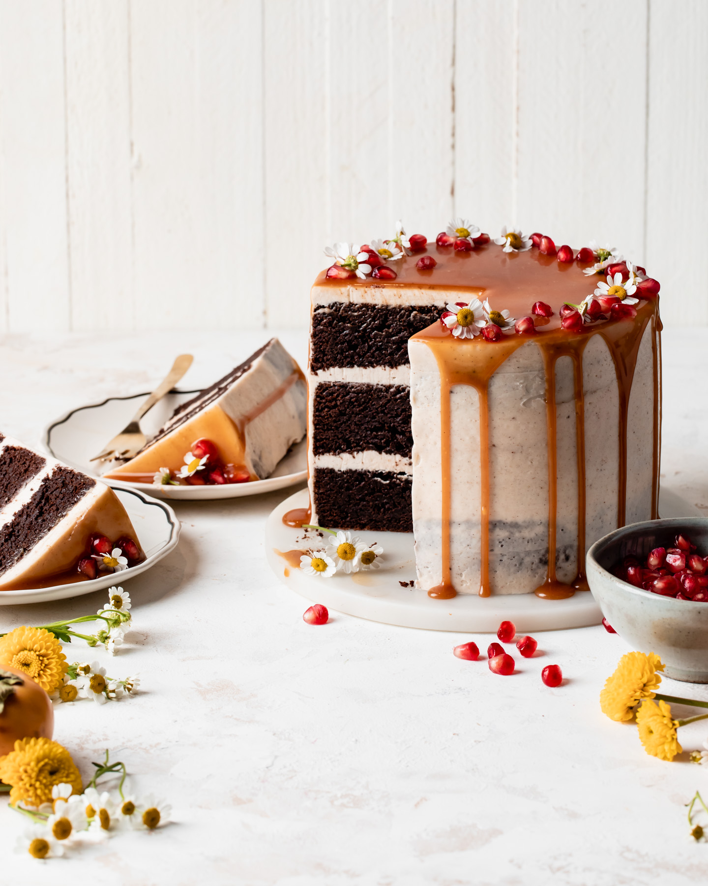 chocolate brownie layer cake with caramel drizzle that has been sliced open