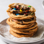 A stack of Crispy chocolate chip cookies with rainbow m and m's