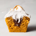 A cross-section of a pumpkin s'mores cupcake