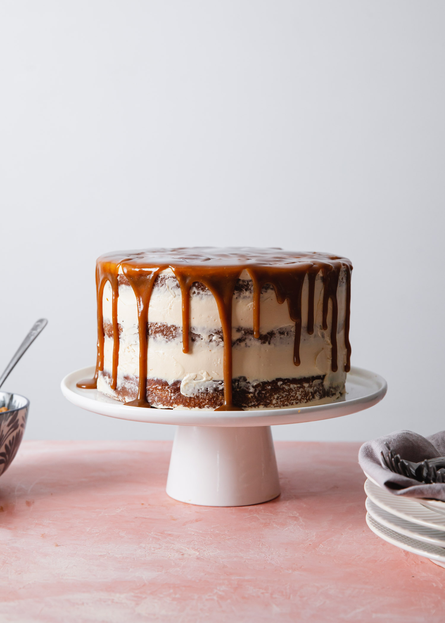 A sticky toffee pudding cake with caramelized white chocolate buttercream and toffee sauce