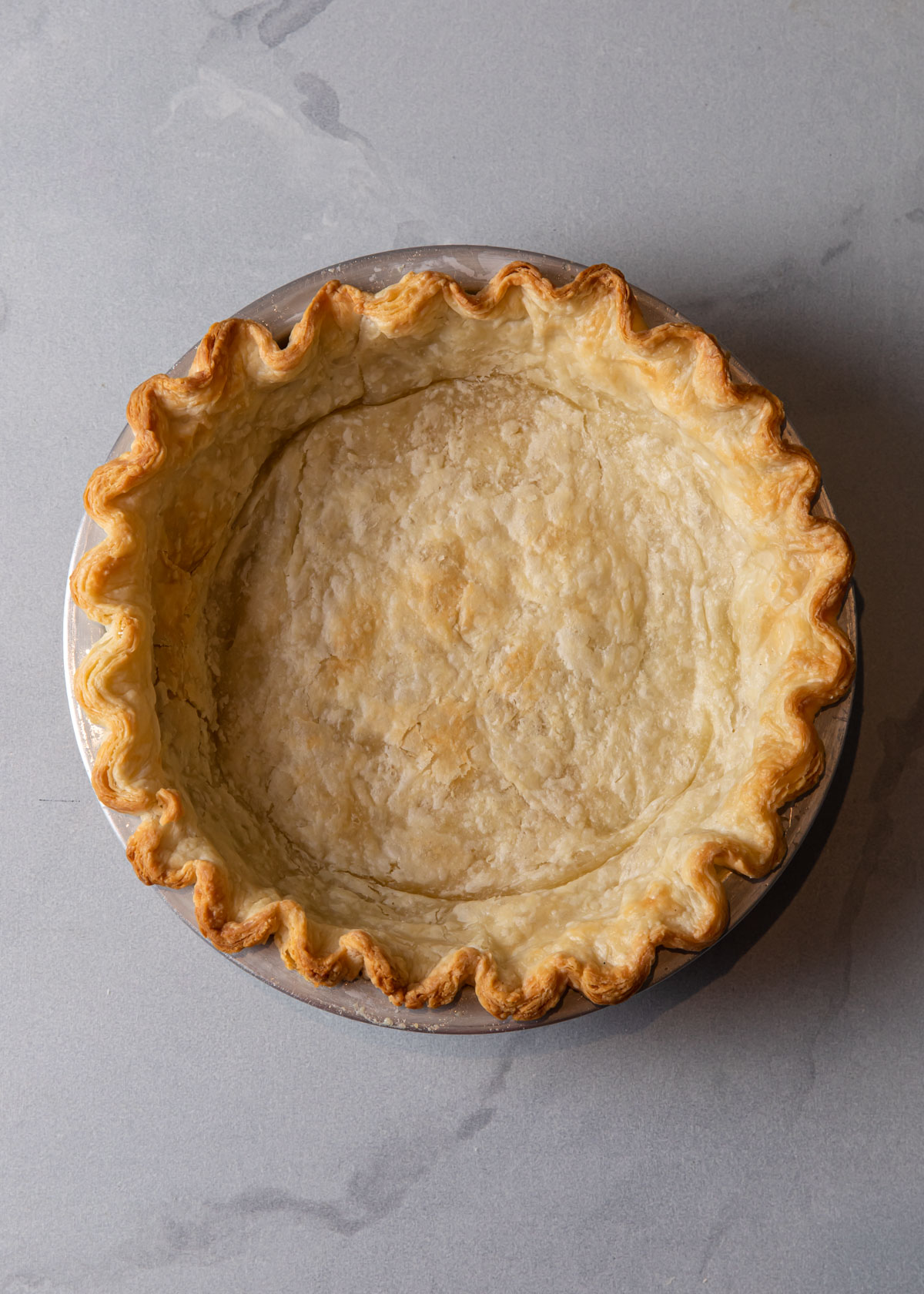 A blind baked pie crust.