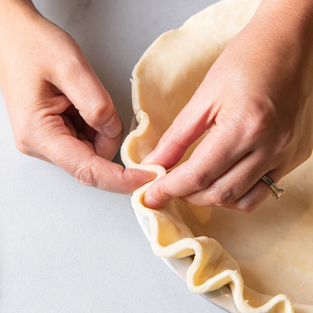 Crimping the edge of a pie crust