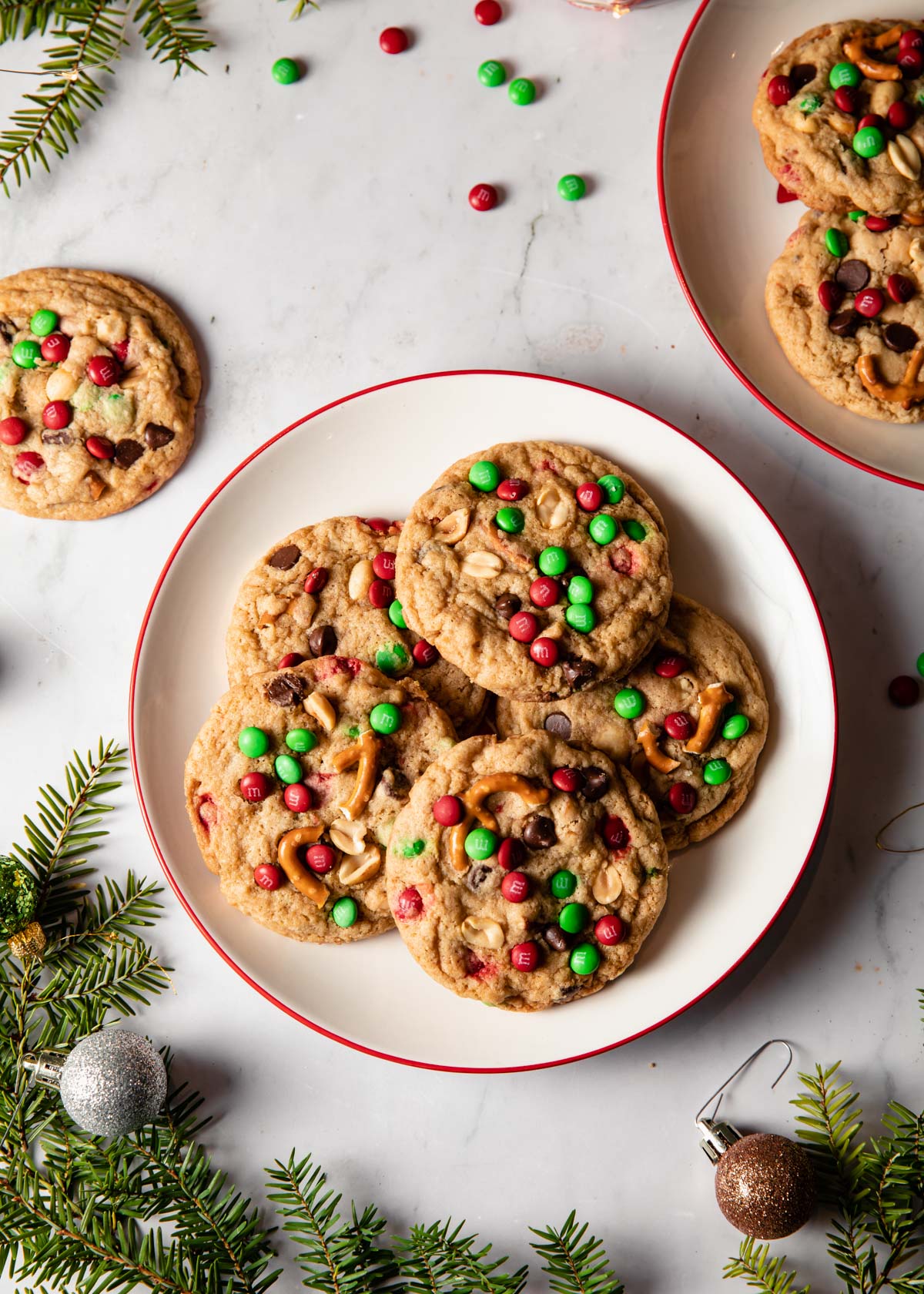 Plates of Christmas kitchen sink chocolate chip cookies on a marble table