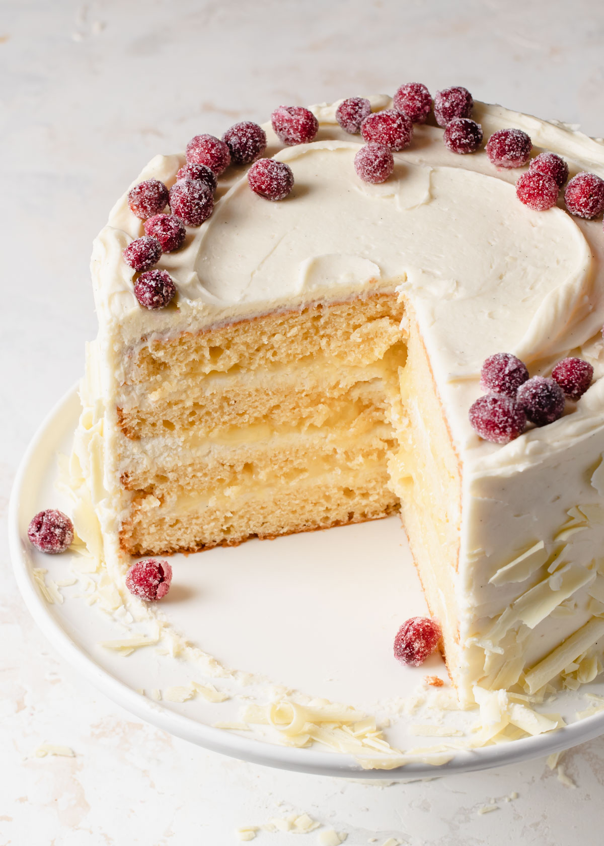 An inside look at a 4-layer lemon cake with lemon curd filling.