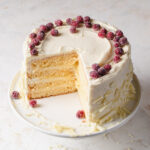A 4-layer lemon curd cake frosted with white chocolate buttercream