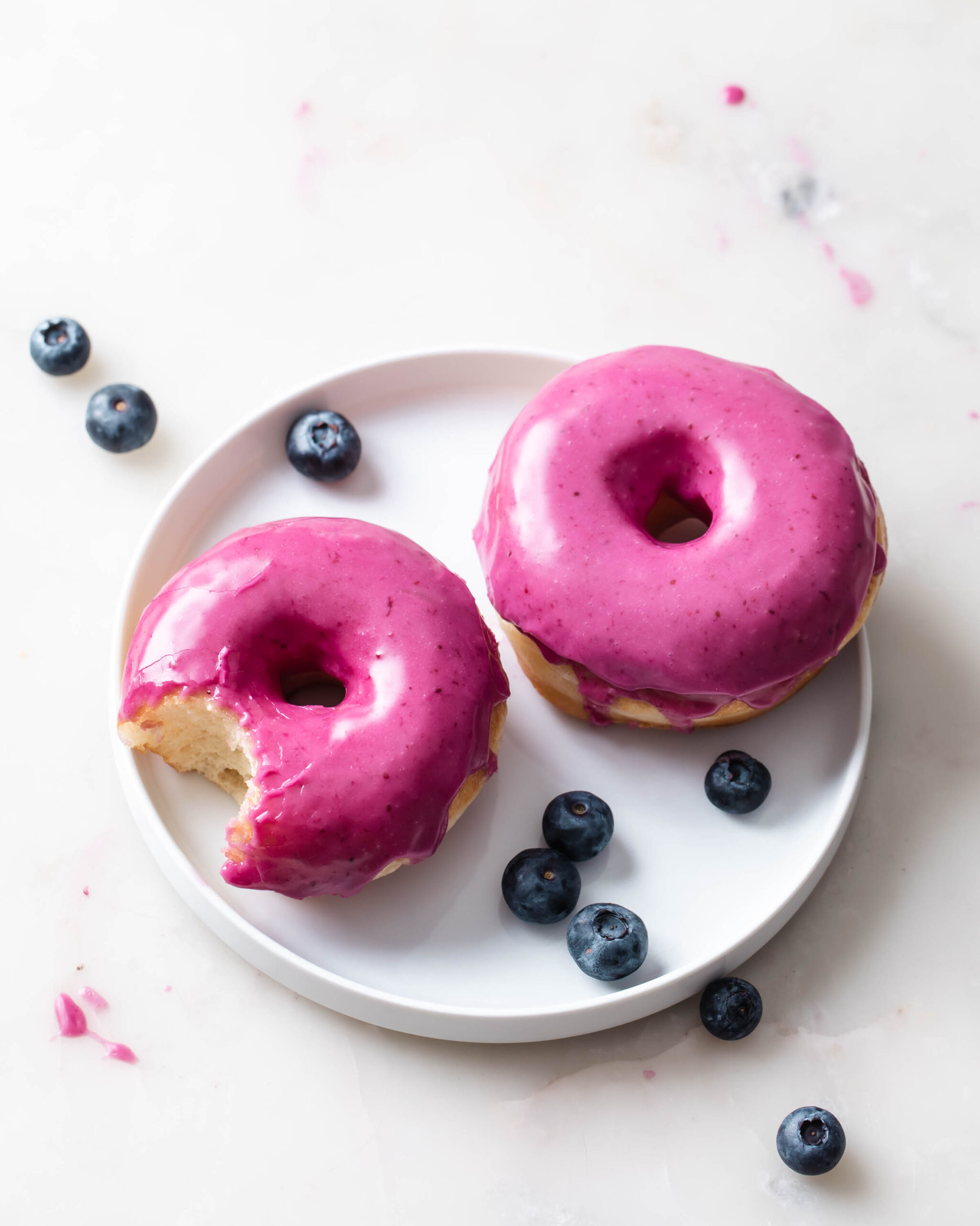 Learn how to bake with yeast to make these blueberry glazed donuts.