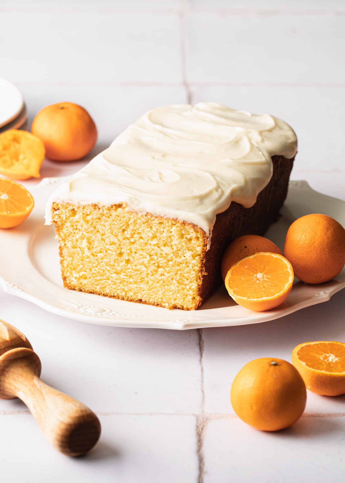 Orange pound cake with vanilla glaze on a serving dish