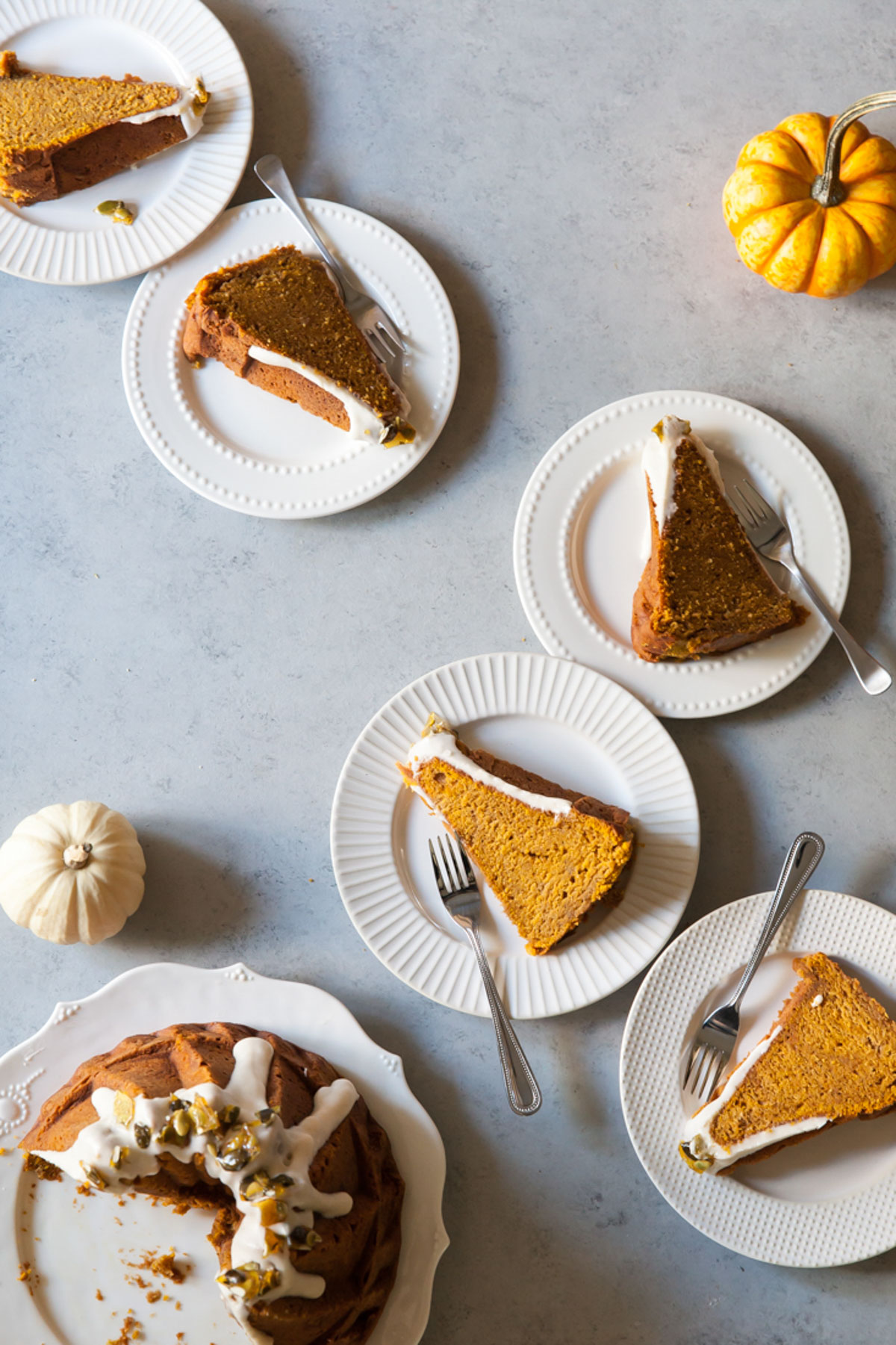 Slices of Pumpkin Bundt Cake with pumpkin seed brittle