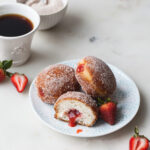 A plate of strawberry rhubarb filled donuts