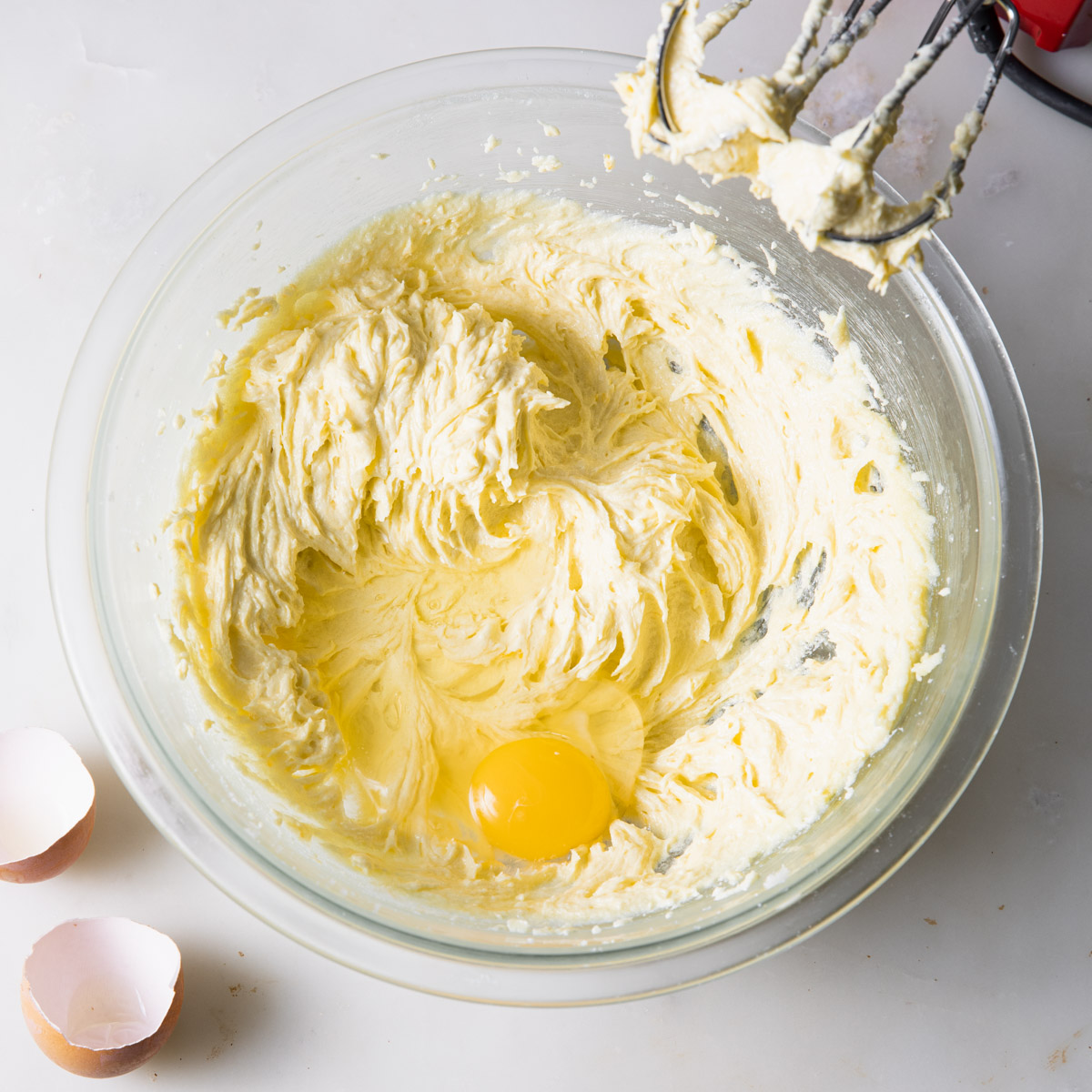 Adding eggs to the lemon loaf batter