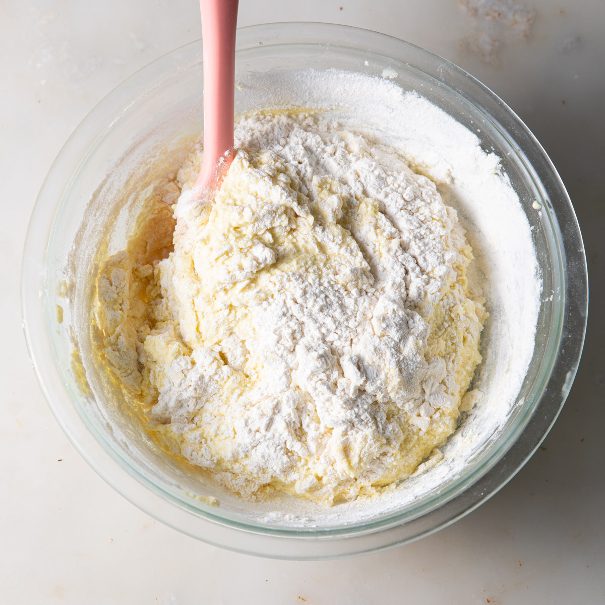 Stirring in the flour to a lemon loaf batter