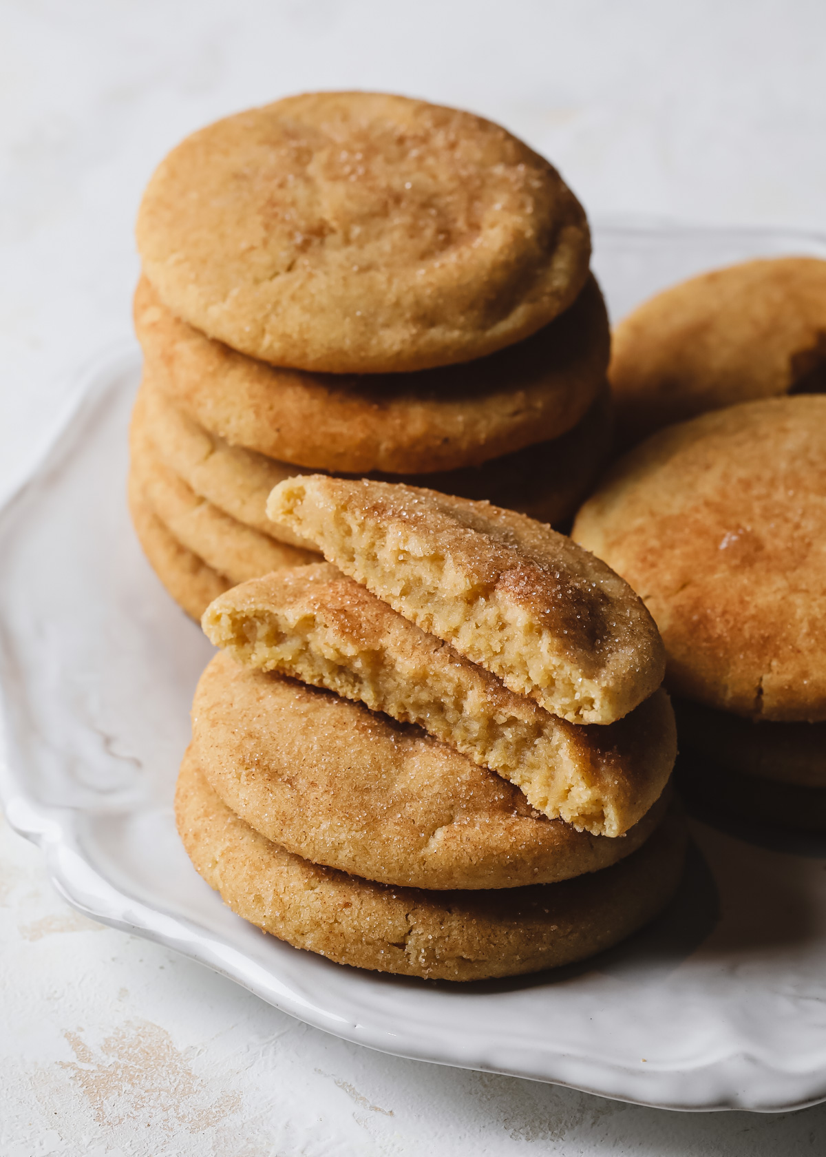 Stacks of brown butter snickerdoodles on a white plate